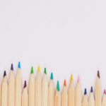 Color Design - colored pencil lined up on top of white surface