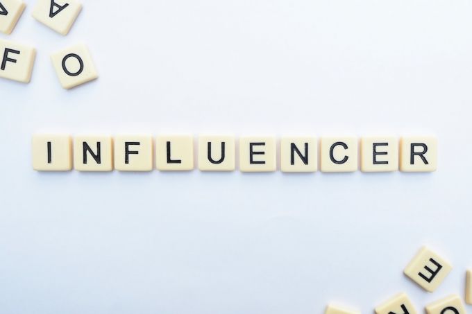 Influencer - influence letters on floor