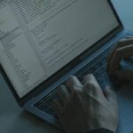 Javascript Frameworks - Hands on a Laptop Keyboard